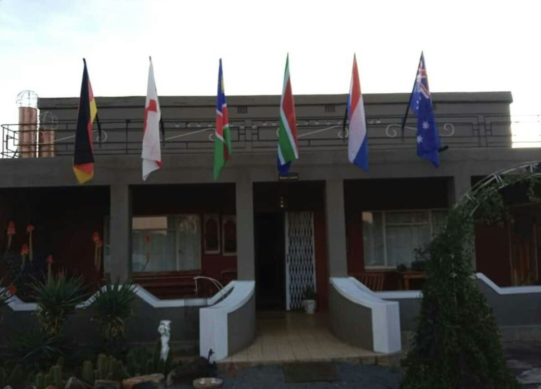 The farm buildings with flags